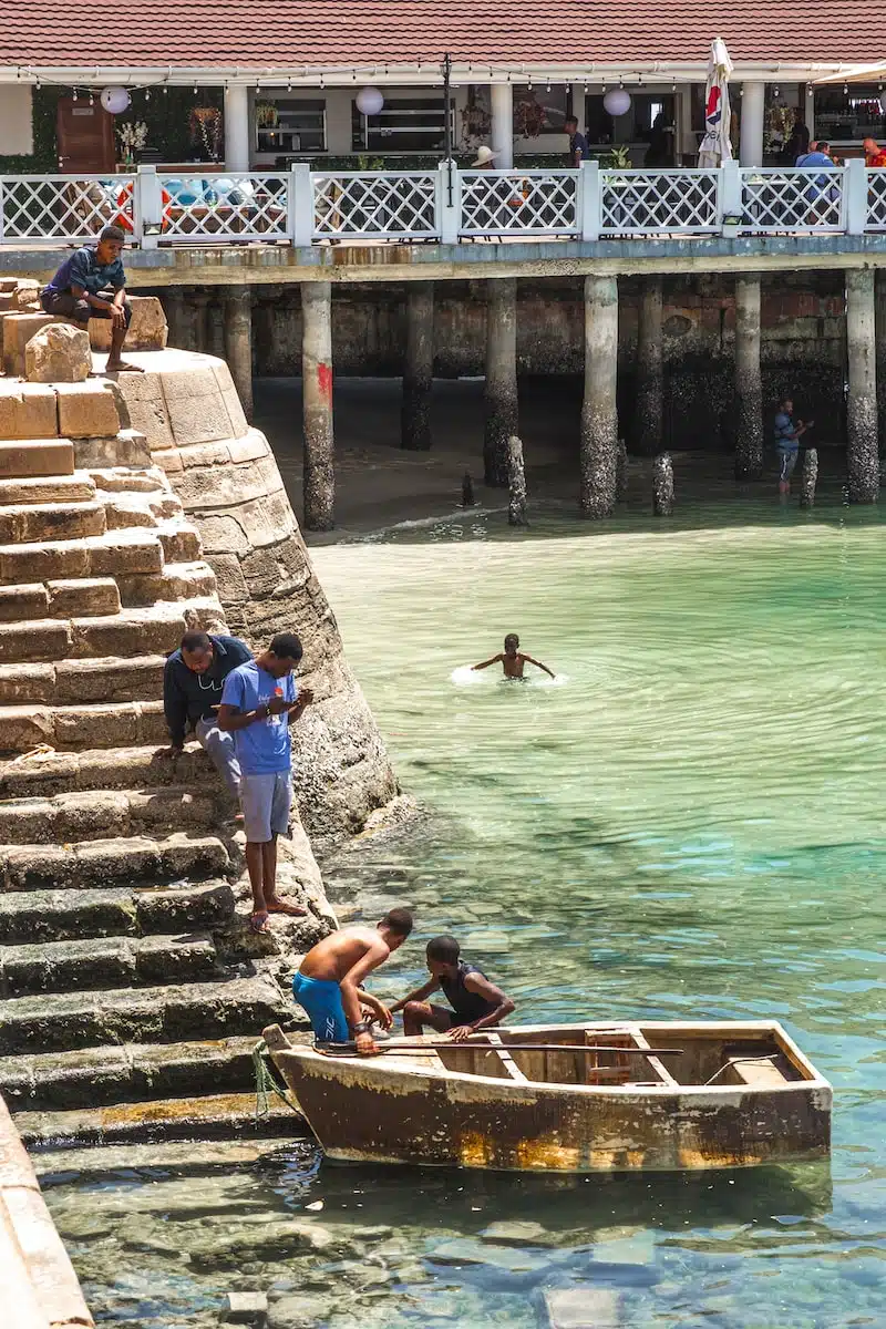 a group of people in a boat in a body of water